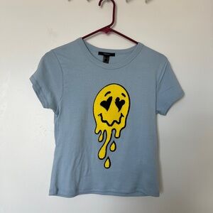 Baby blue top with sequin smiley face